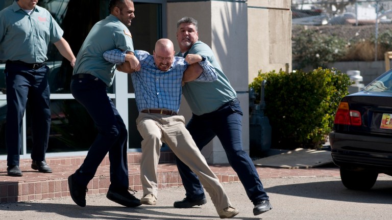 Walter White (Bryan Cranston) dragged away kicking and screaming in Breaking Bad season 3.
