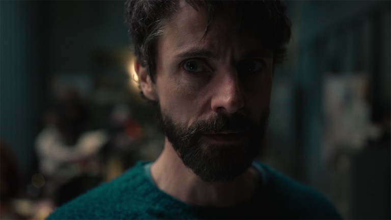 Matthew Goode looking worried with a beard in Dept. Q on Netflix