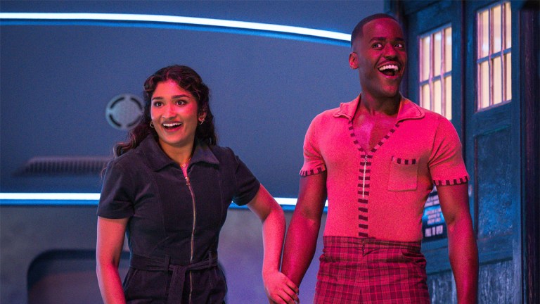 Varada Sethu as Belinda Chandra in a cord jumpsuit and Ncuti Gatwa as the Doctor in tartan trousers and an orange top in Doctor Who episode 2-6