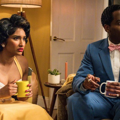 Varada Sethu and Ncuti Gatwa wearing 1950s clothing sitting holding coffee mugs