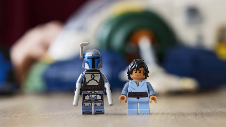 Jango Fett figure standing in front of LEGO ship