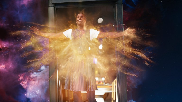 Ncuti Gatwa as the Fifteenth Doctor standing in the TARDIS doorway emitting regeneration energy